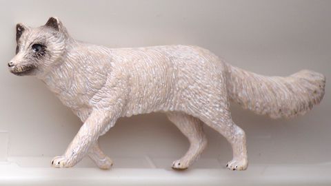 A arctic fox figurine.